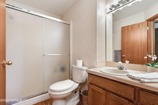 101 N 48th Ave Unit 31A, Yakima, WA 98908 - full bathroom featuring wallpapered walls, vanity, a stall shower, and wood finished floors