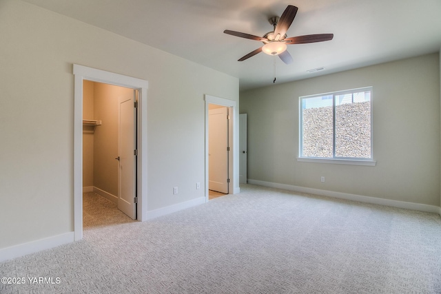 302 N 90th Ave, Yakima, WA 98908 - unfurnished bedroom with carpet flooring, a spacious closet, and a ceiling fan