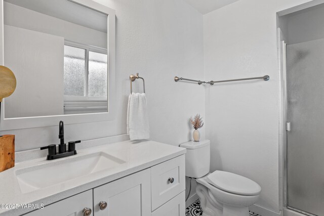 4704 W Prasch Ave, Yakima, WA 98908 - full bathroom featuring toilet, vanity, and a shower with shower door