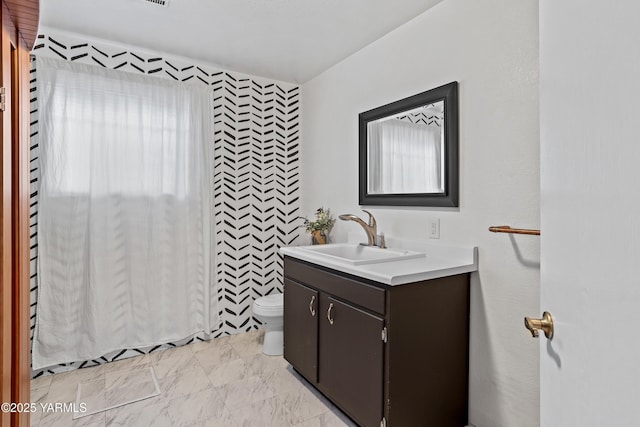4704 W Prasch Ave, Yakima, WA 98908 - bathroom with marble finish floor, toilet, and vanity
