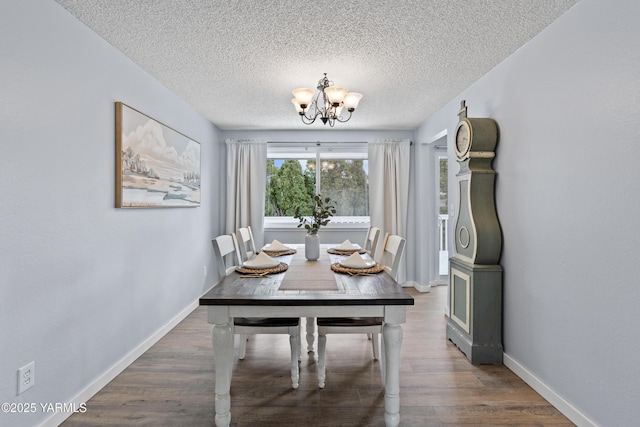 4704 W Prasch Ave, Yakima, WA 98908 - dining space featuring a textured ceiling, baseboards, wood finished floors, and a chandelier