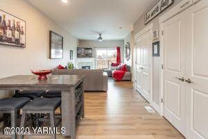 dining area featuring a fireplace and light wood-style floors