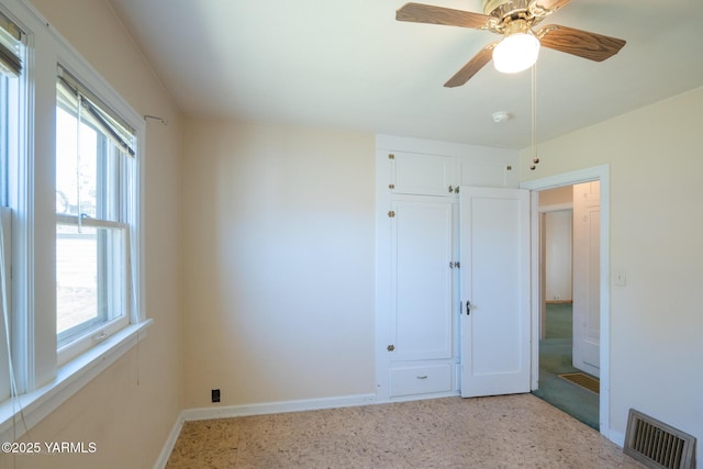 1012 S 29th Ave, Yakima, WA 98902 - unfurnished bedroom with baseboards, light carpet, and a ceiling fan