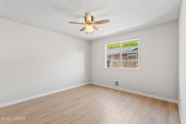 1805 S 66th Ave, Yakima, WA 98908 - unfurnished room featuring wood finished floors, a ceiling fan, and a textured ceiling