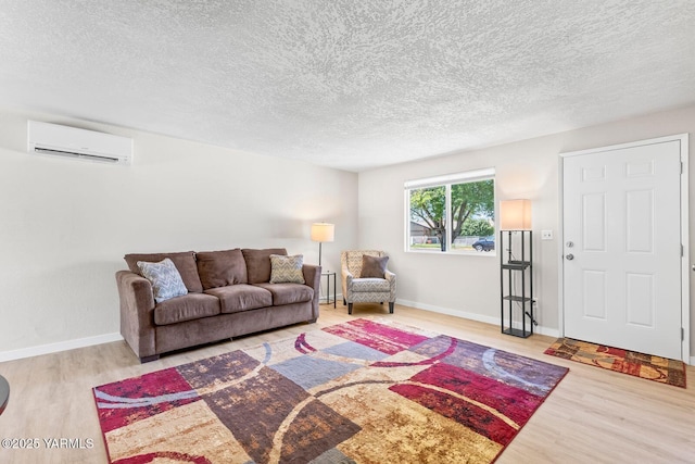 1805 S 66th Ave, Yakima, WA 98908 - living area featuring a wall mounted AC, wood finished floors, and a textured ceiling