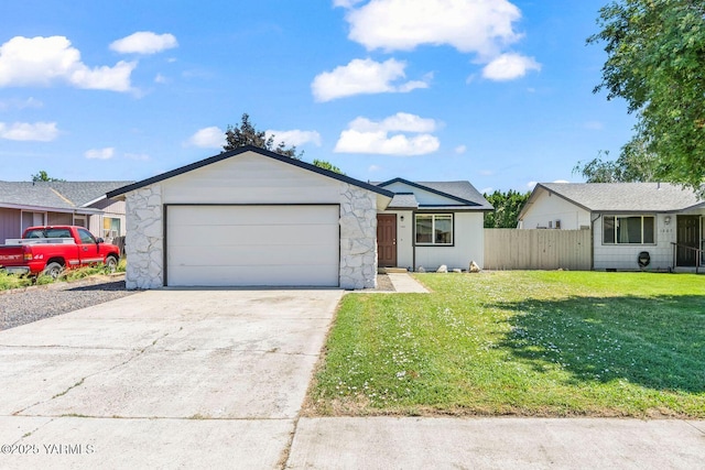 1805 S 66th Ave, Yakima, WA 98908 - single story home with a garage, concrete driveway, and stone siding