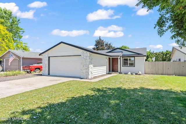 1805 S 66th Ave, Yakima, WA 98908 - ranch-style house with an attached garage, driveway, and stone siding