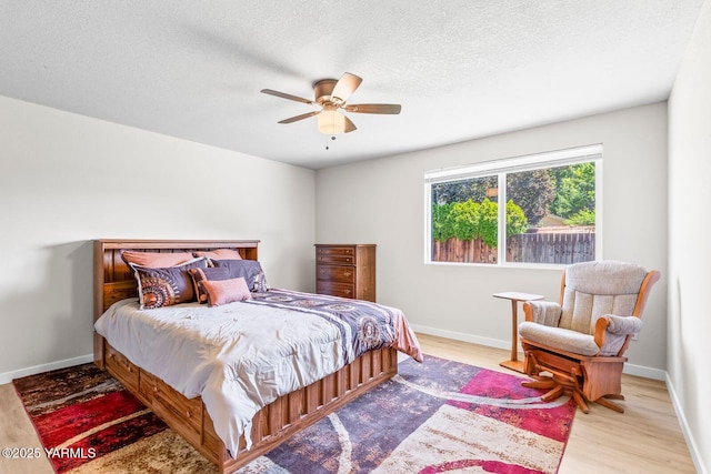 1805 S 66th Ave, Yakima, WA 98908 - bedroom with wood finished floors, a textured ceiling, and a ceiling fan