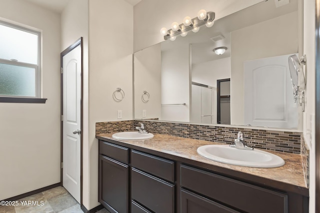 5901 Coolidge Rd, Yakima, WA 98903 - full bathroom featuring decorative backsplash, double vanity, and a closet