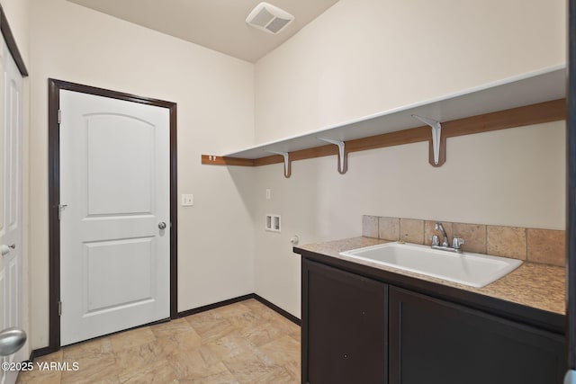 5901 Coolidge Rd, Yakima, WA 98903 - washroom featuring cabinet space, hookup for a washing machine, and light stone finish flooring