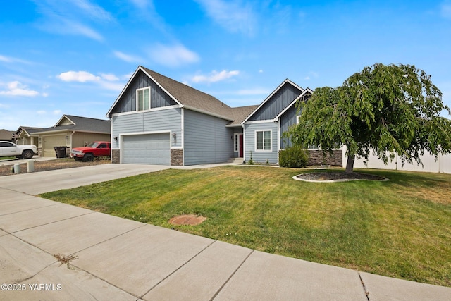 5901 Coolidge Rd, Yakima, WA 98903 - craftsman-style home featuring board and batten siding, an attached garage, a front lawn, driveway, and stone siding