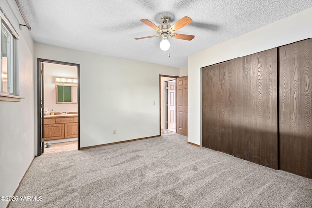 3204 Clinton Way, Yakima, WA 98902 - unfurnished bedroom with light carpet, a closet, a textured ceiling, ensuite bath, and a ceiling fan