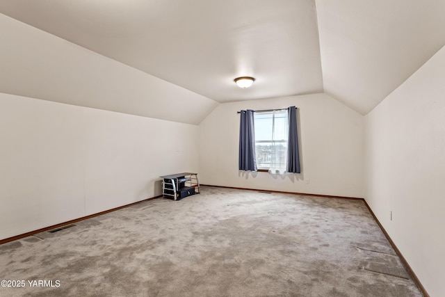 bonus room with carpet floors, lofted ceiling, and baseboards