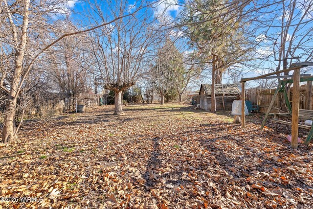 view of yard with fence