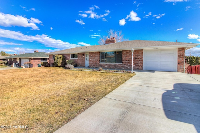 single story home with an attached garage, brick siding, concrete driveway, a front lawn, and a chimney