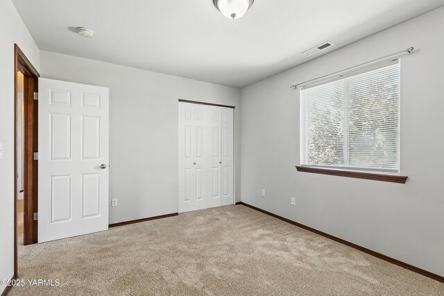 5807 W Whatcom Ave, Yakima, WA 98903 - unfurnished bedroom with carpet floors and a closet