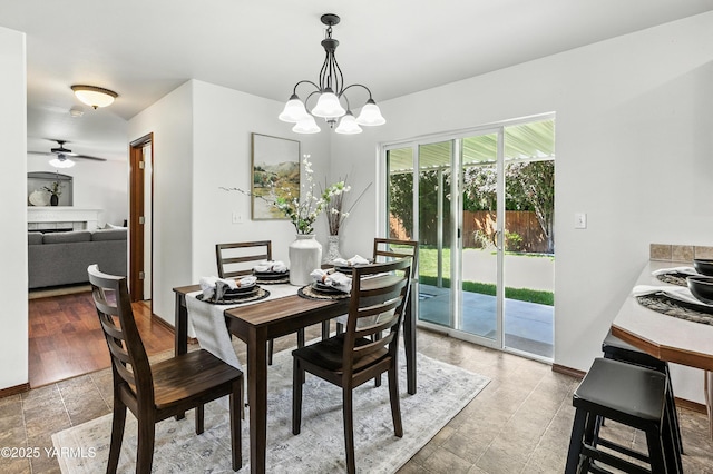 5807 W Whatcom Ave, Yakima, WA 98903 - dining area featuring a chandelier and ceiling fan