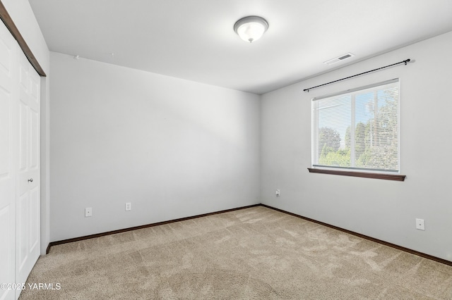 5807 W Whatcom Ave, Yakima, WA 98903 - unfurnished bedroom featuring carpet flooring and a closet