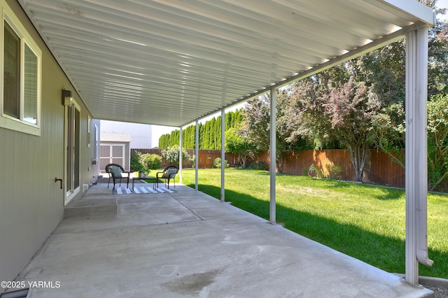 5807 W Whatcom Ave, Yakima, WA 98903 - fenced backyard with a storage unit and a patio area