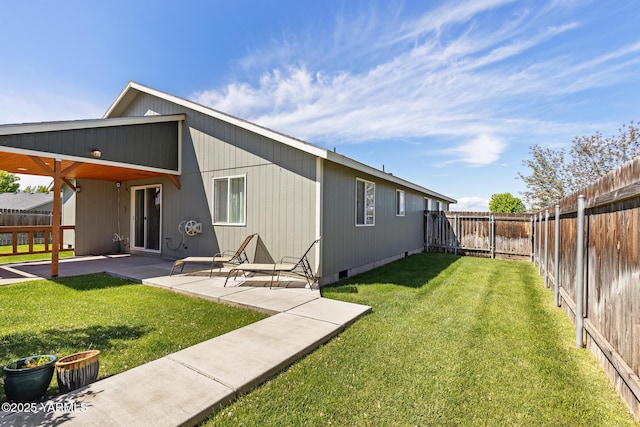rear view of property featuring a patio and crawl space