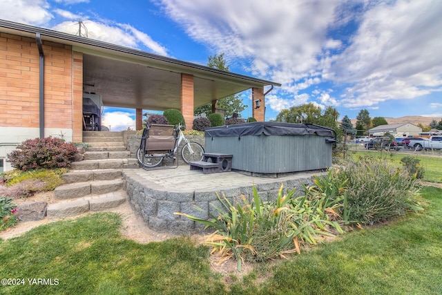 exterior space with a hot tub