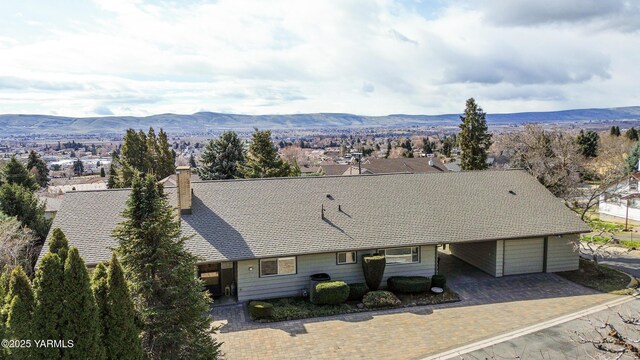 drone / aerial view featuring a mountain view