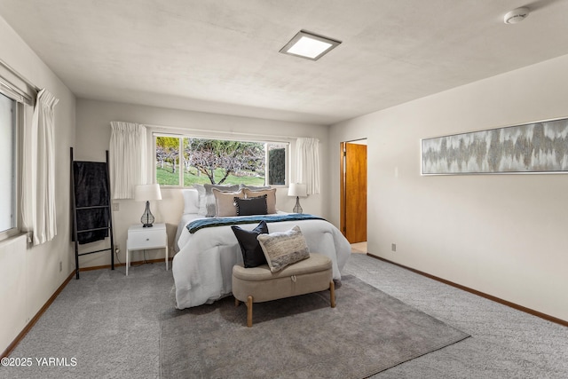 bedroom featuring baseboards and carpet
