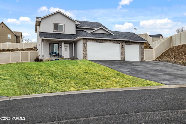 view of front of home featuring aphalt driveway, fence, an attached garage, and stucco siding