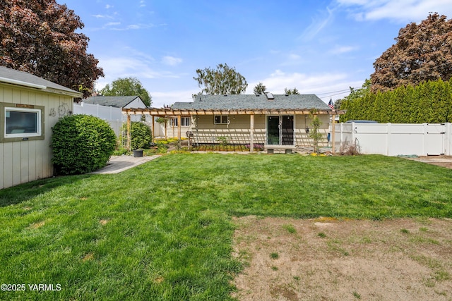 rear view of house featuring a lawn, a pergola, and a fenced backyard
