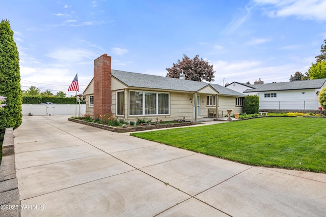 ranch-style home featuring fence, a chimney, a gate, and a front yard