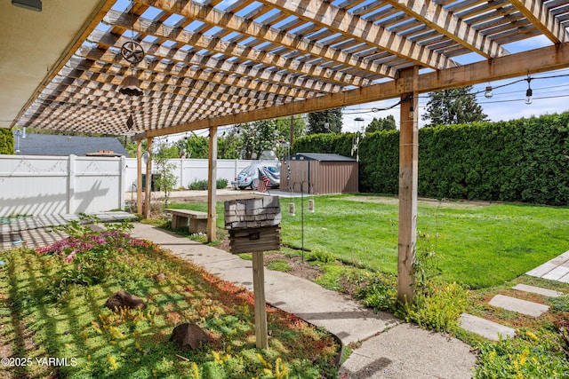 view of yard with a fenced backyard, an outdoor structure, a pergola, and a shed