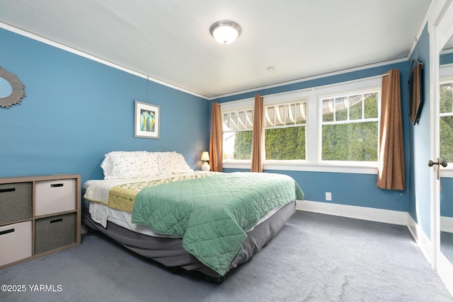 bedroom with carpet flooring, baseboards, and ornamental molding
