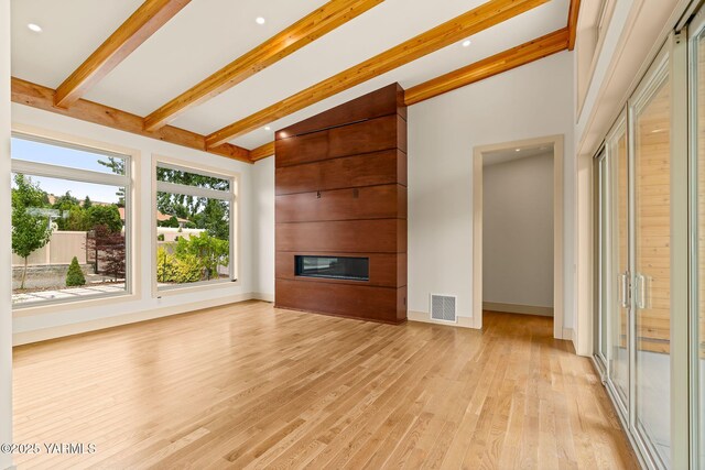 8 N 96th Ave, Yakima, WA 98908 - unfurnished living room with a fireplace and light wood-type flooring
