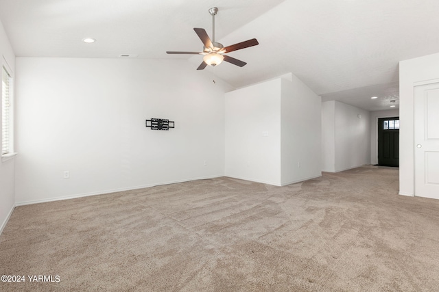 spare room with lofted ceiling, ceiling fan, light carpet, and recessed lighting