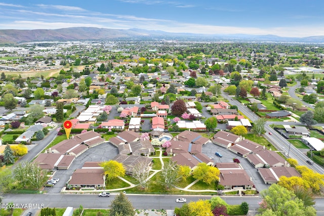 drone / aerial view featuring a mountain view and a residential view