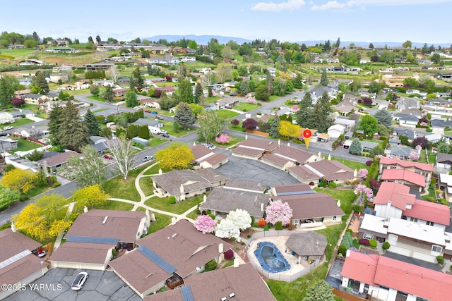 bird's eye view featuring a mountain view and a residential view