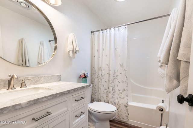 bathroom with vanity, shower / bathtub combination with curtain, toilet, and wood finished floors