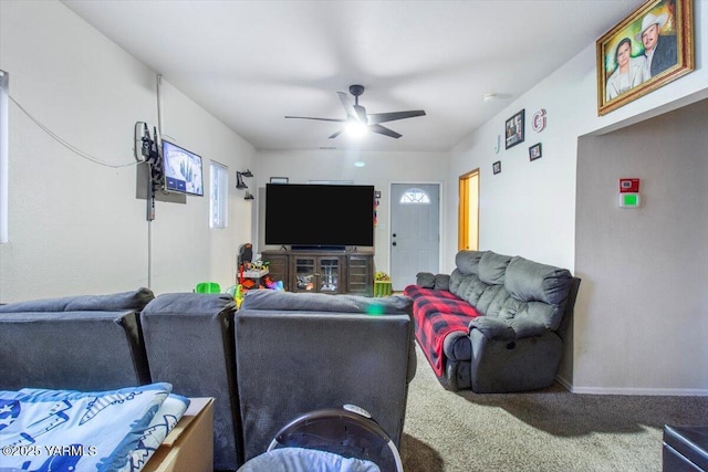 living room with ceiling fan, carpet, and baseboards