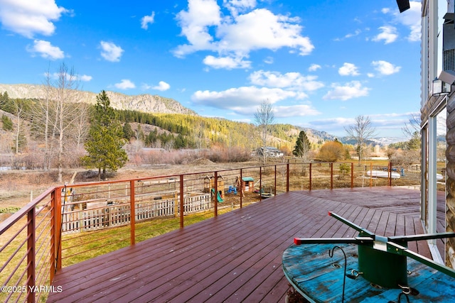 wooden deck featuring a mountain view