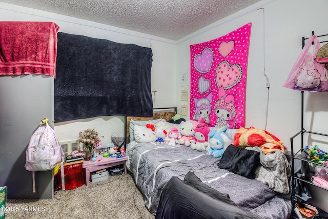 bedroom with carpet flooring and a textured ceiling