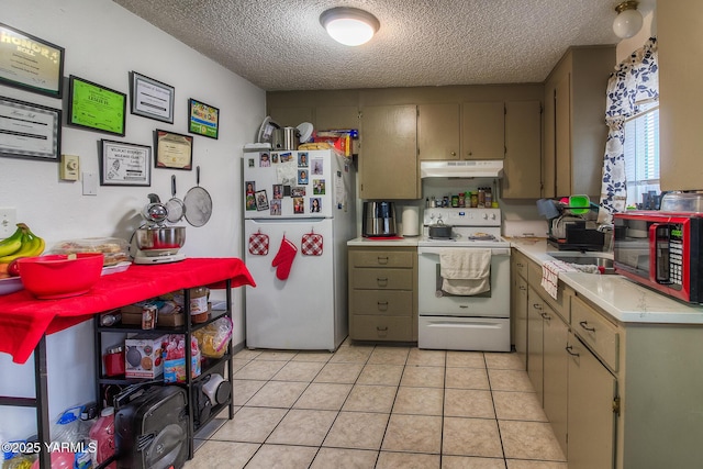 kitchen with white appliances, light tile patterned floors, light countertops, a textured ceiling, and under cabinet range hood