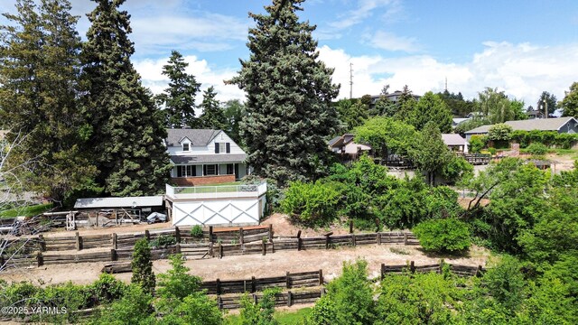 view of community featuring fence