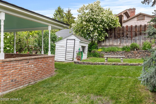 view of yard with a storage unit and an outdoor structure