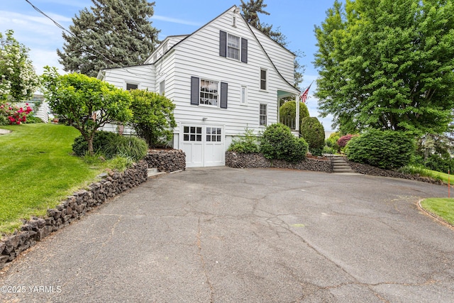 view of side of home featuring a lawn