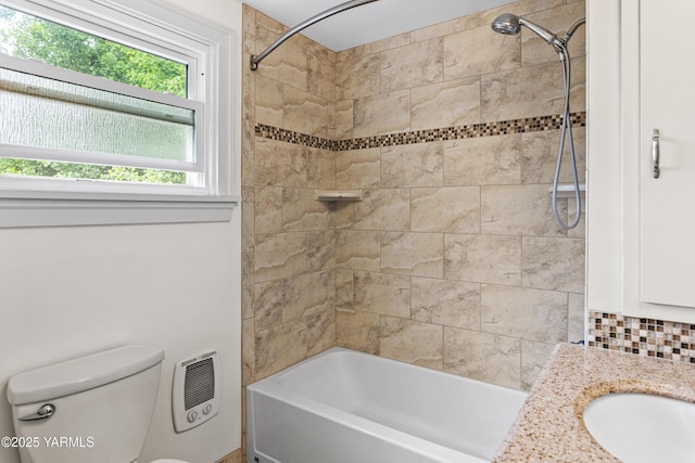 full bath with toilet, a sink, shower / bath combination, and backsplash