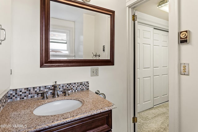 bathroom with backsplash and vanity