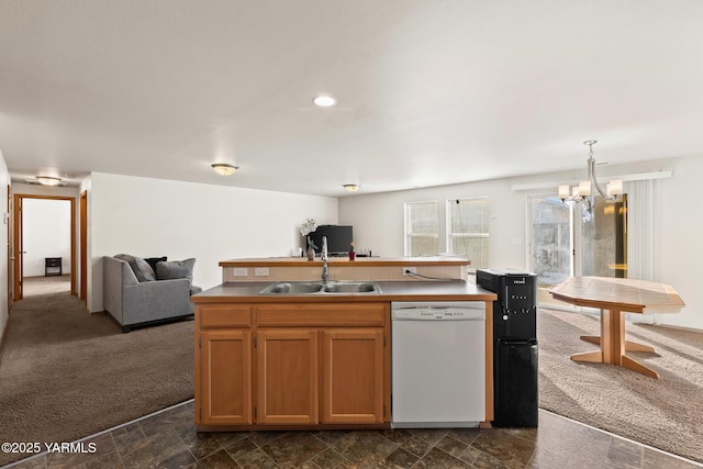 kitchen featuring open floor plan, light countertops, dishwasher, dark colored carpet, and a center island with sink