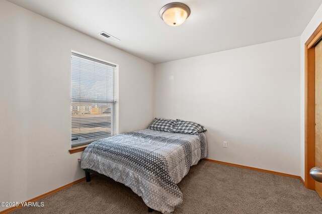 bedroom featuring carpet, visible vents, and baseboards