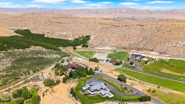 drone / aerial view featuring a mountain view