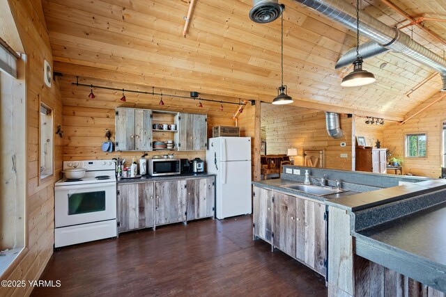 kitchen with dark countertops, wooden ceiling, hanging light fixtures, a sink, and white appliances